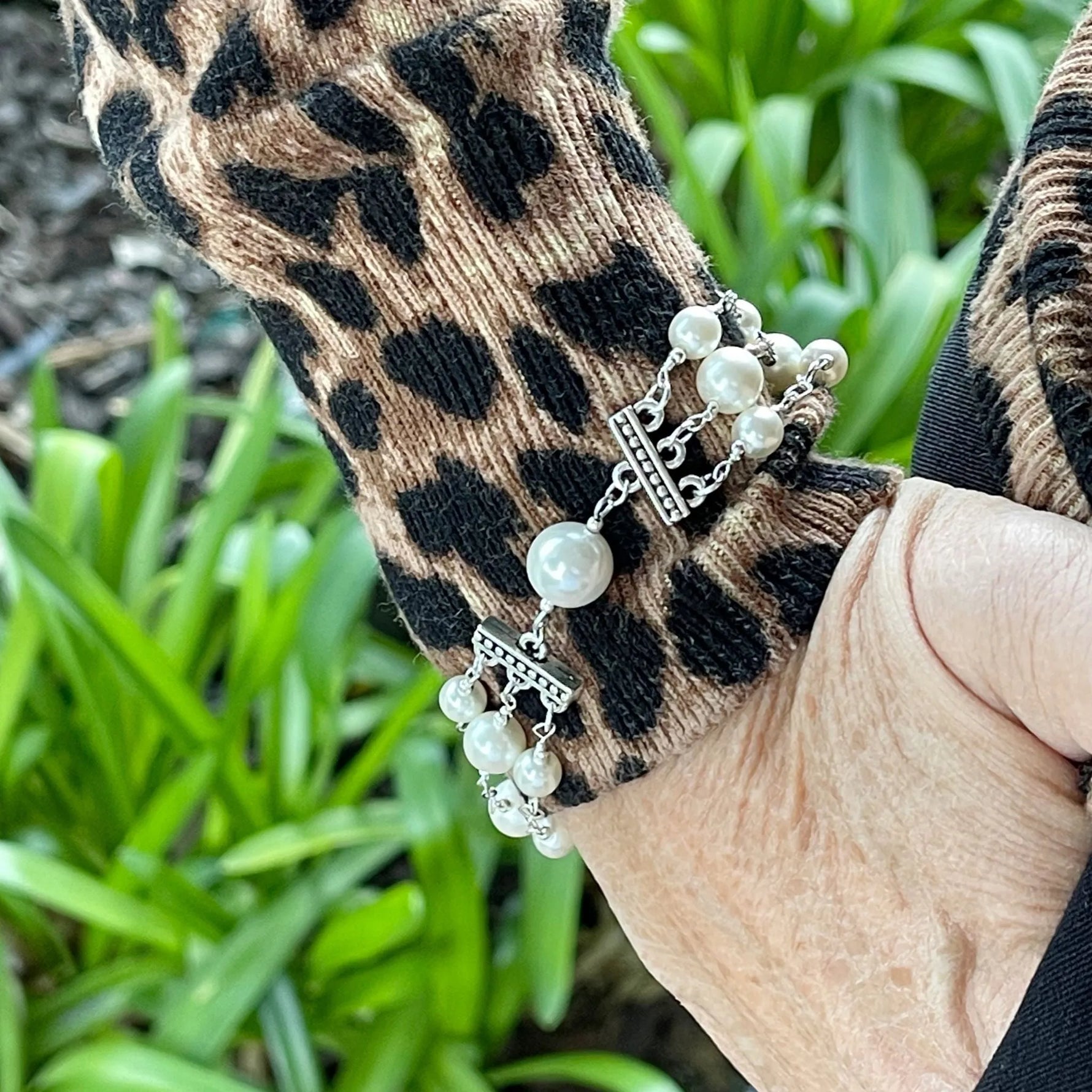 Calla Triple Pearl Bracelet worn on wrist showing elegant layered pearl design