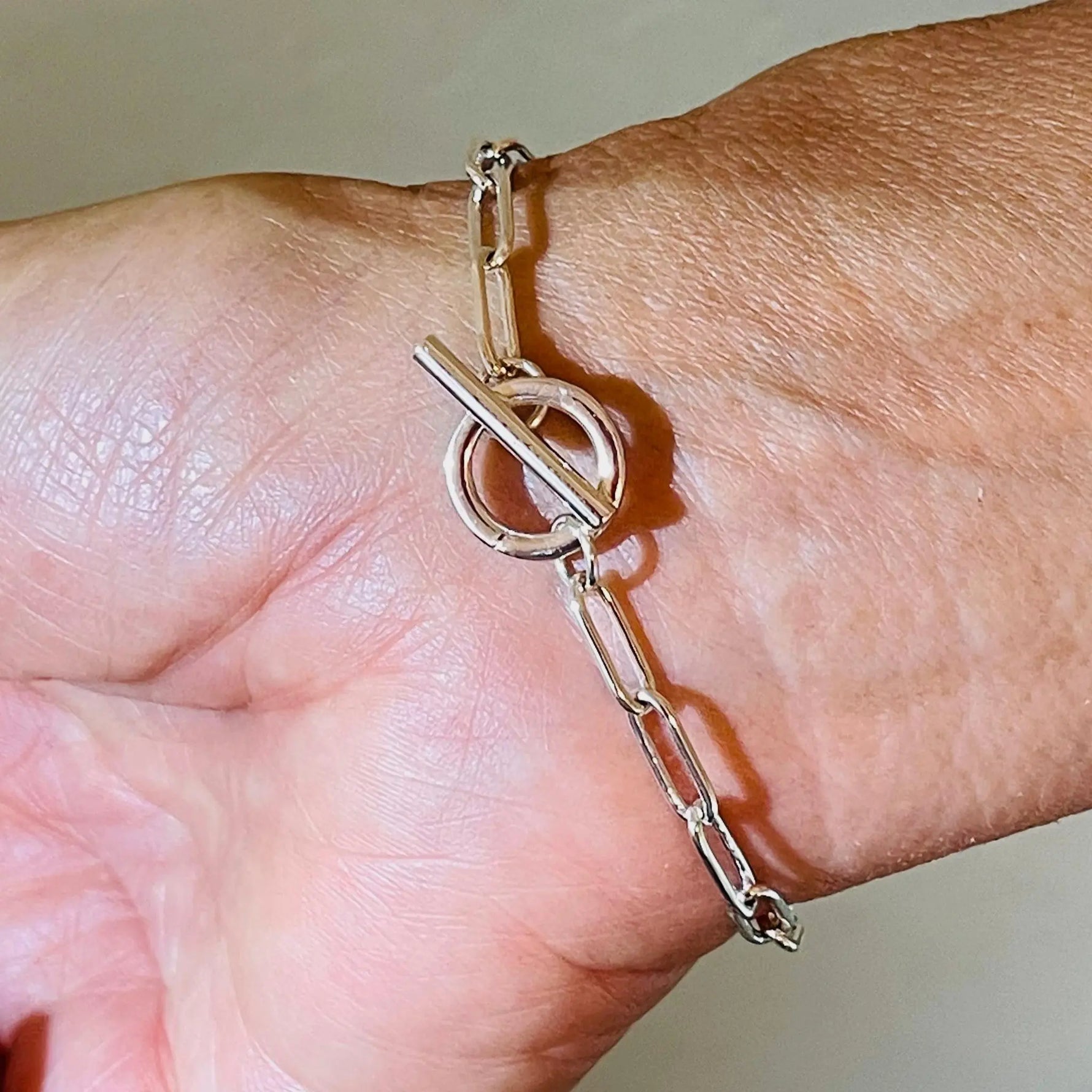 Detail view of the Callie Freshwater Pearl & Sterling Silver Bracelet clasp and chain, highlighting the polished sterling silver finish and secure, elegant closure.