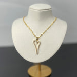 Cara Gold Heart A Necklace displayed on jewelry bust highlighting pave heart pendant