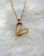 Detailed view of the Cara Gold Heart B Necklace showing pave crystal heart design