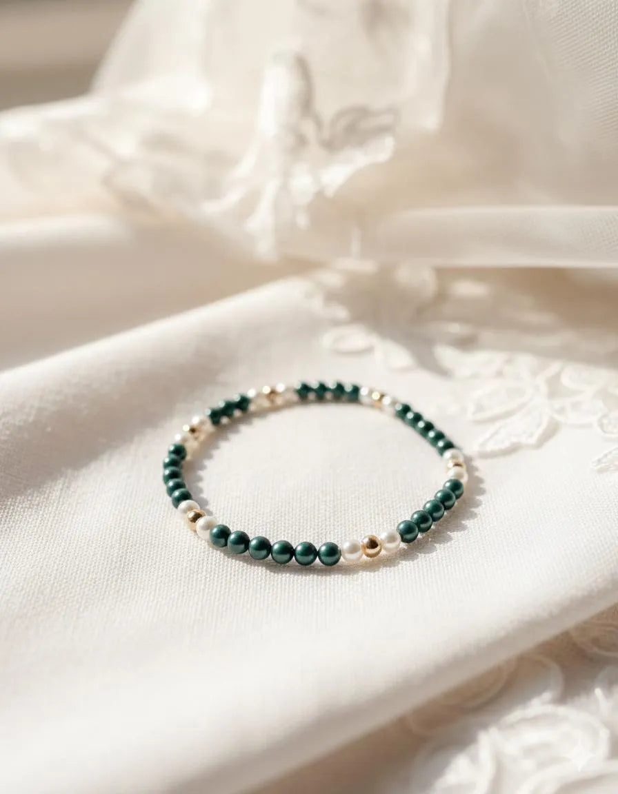 Kaia Pearl Stretch Bracelet styled on soft neutral fabric with delicate lace details for a timeless, elegant lifestyle presentation