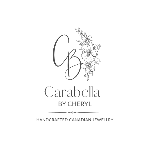 Charcoal logo for Carabella by Cheryl handcrafted Canadian jewellery, featuring a stylized 'CB' monogram with floral line art on a plain white background.