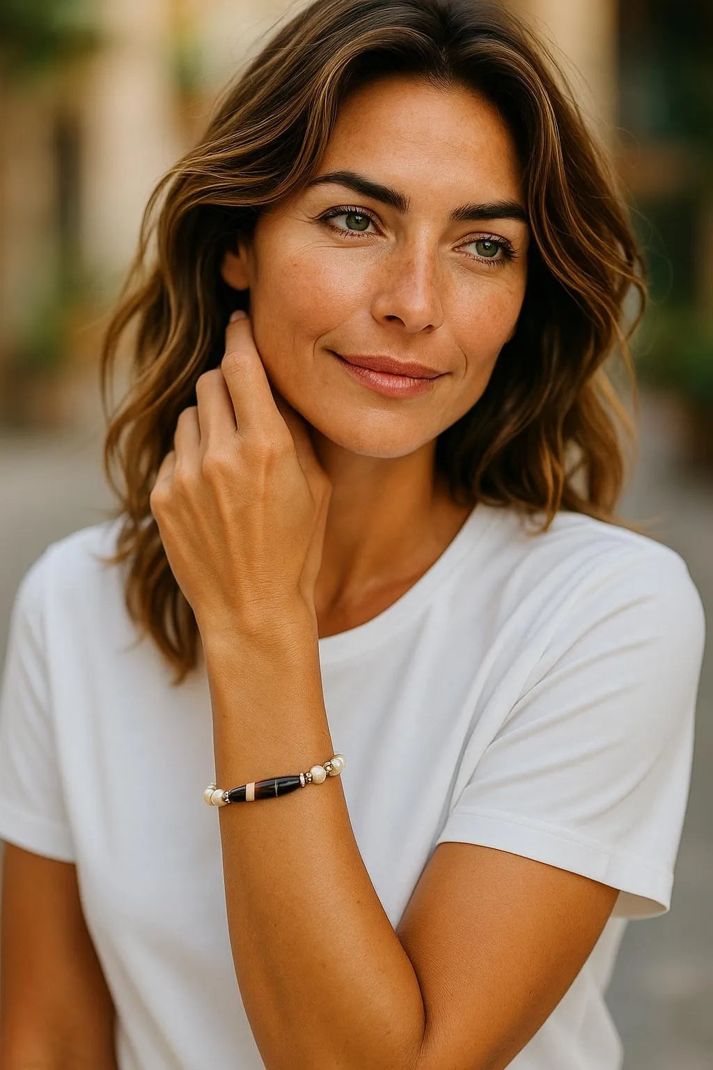 Model wearing the Elodie Pearl & Gemstone Bracelet, showcasing its refined balance of luminous pearls, blue chalcedony, and sculptural Tibetan agate in an elegant everyday style