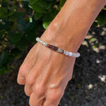 Elodie Pearl & Gemstone Bracelet worn on the wrist outdoors, blending European crystal pearls, calming blue chalcedony, and antique silver accents for effortless sophistication