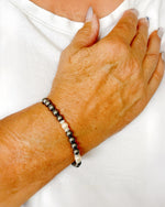 Jan Black Pearl Bracelet worn on wrist showing elegant black pearl stretch design