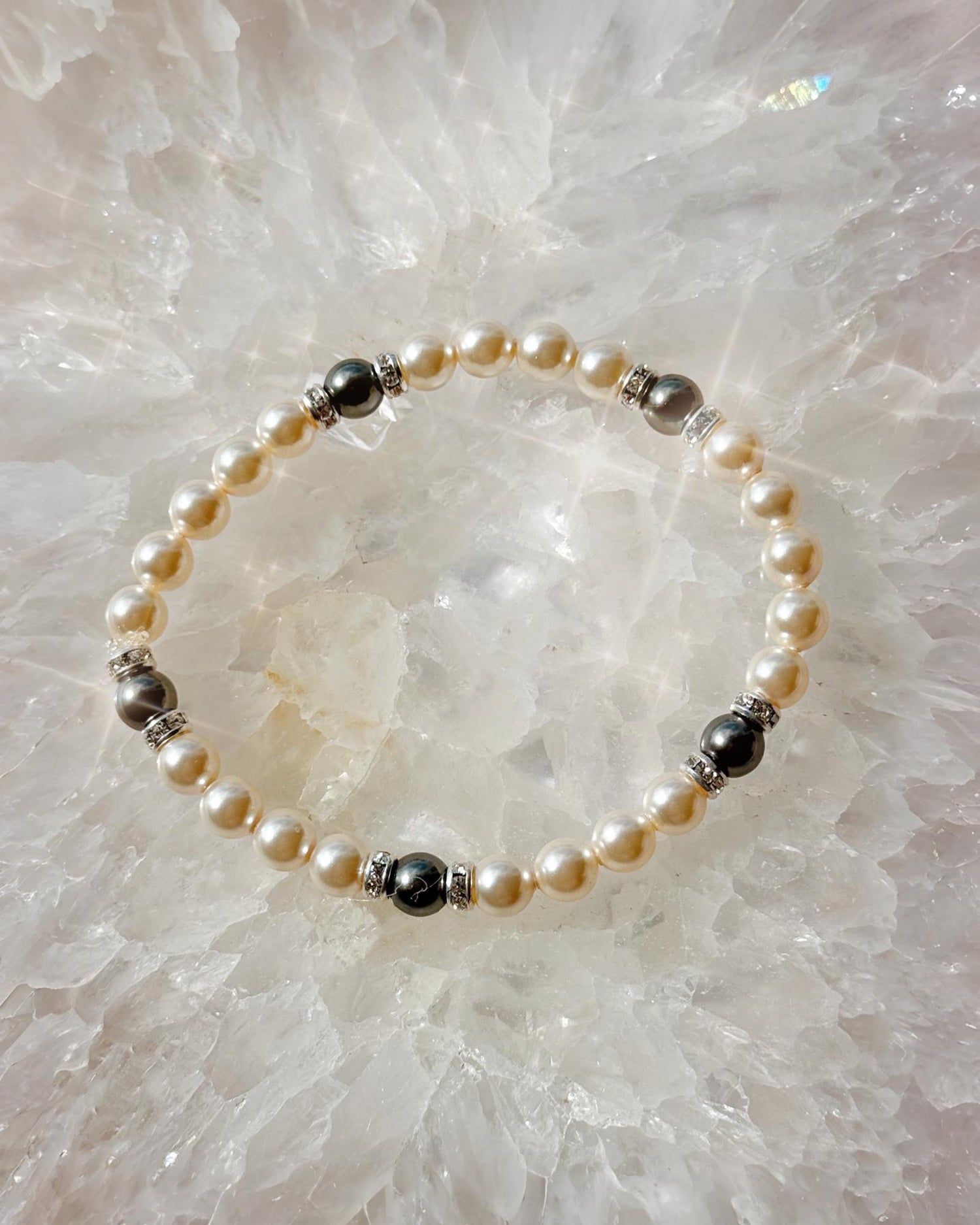 Handcrafted Juanita Pearl Stretch Bracelet featuring European crystal cream pearls and dark grey pearls arranged in a refined stretch design