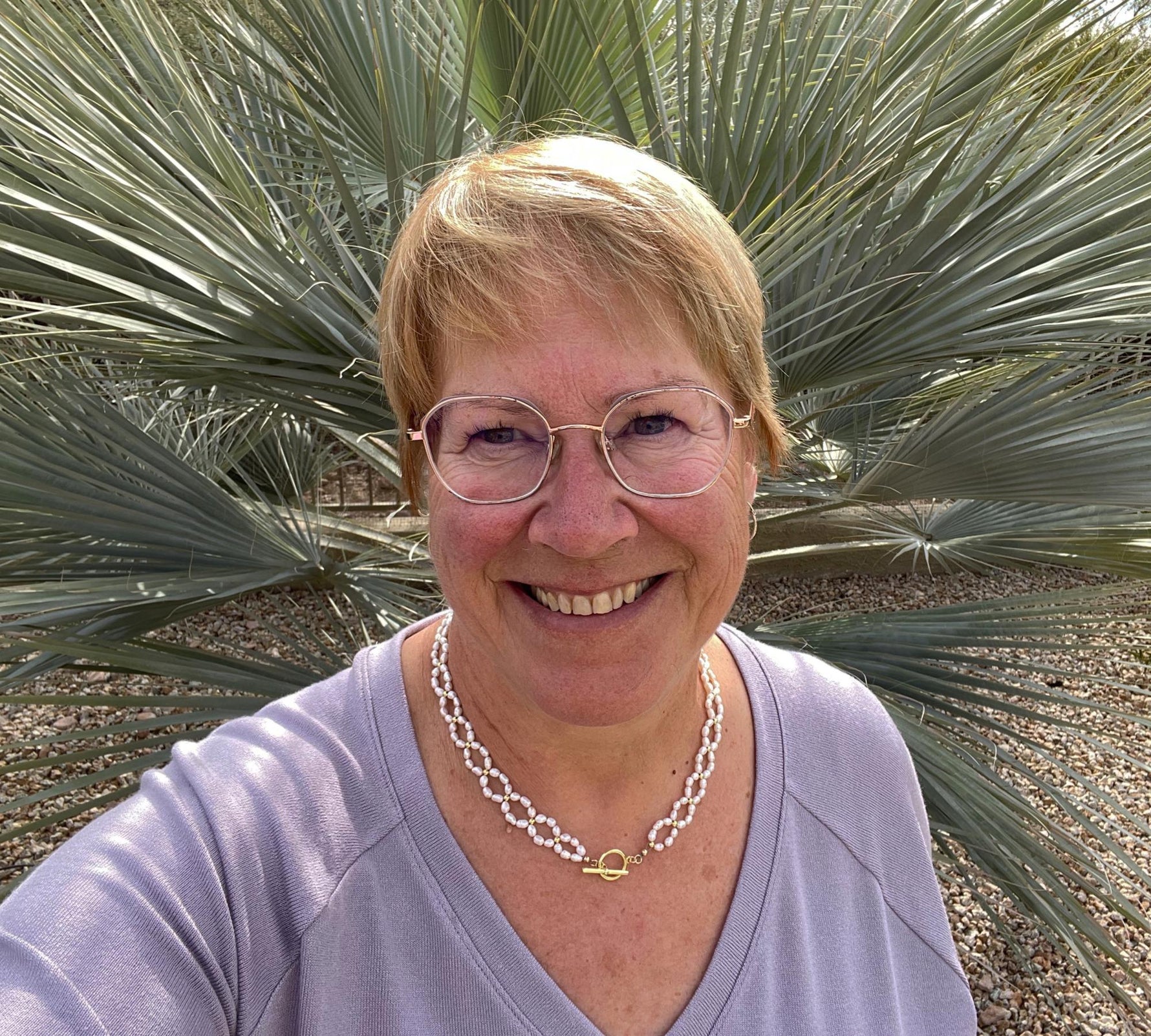 Kailani Freshwater Pearl Necklace worn as an elegant statement, blending organic pearls with delicate gold accents for refined everyday luxury