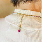 Close up view of the Layla Gemstone Necklace clasp and extension chain featuring coordinating tourmaline and ruby accents.