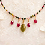 Layla Rainbow Tourmaline Necklace detail featuring faceted rainbow tourmaline gemstones, ruby gemstone drops, carved jade pendant, and gold-filled accents.