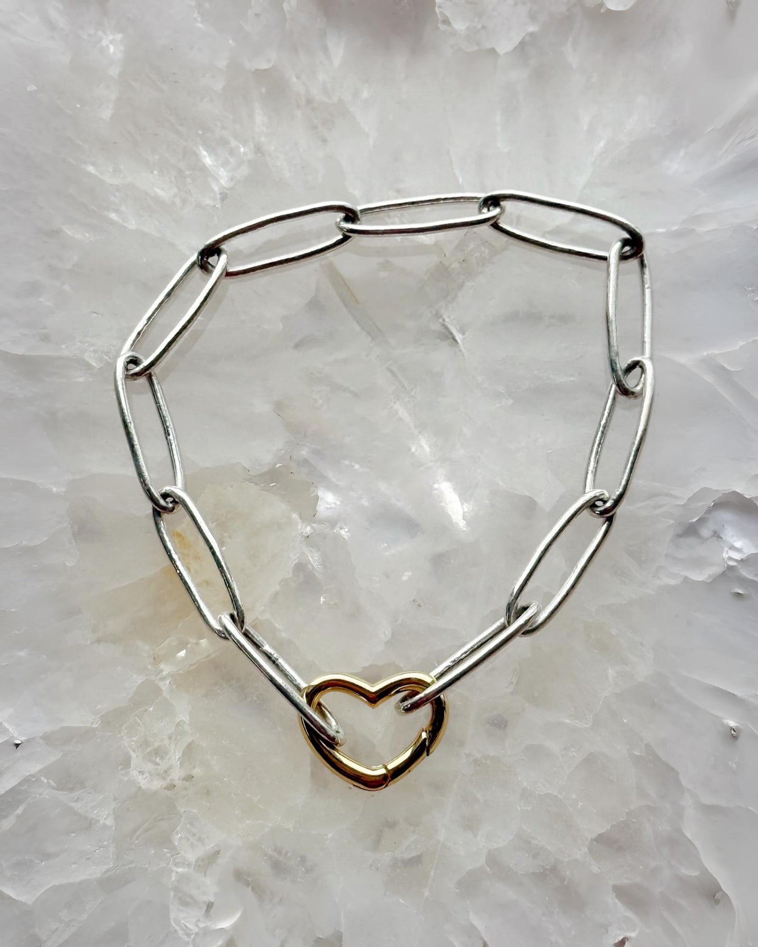 Mixed metal paperclip bracelet with silver chain and gold heart clasp handcrafted in Canada