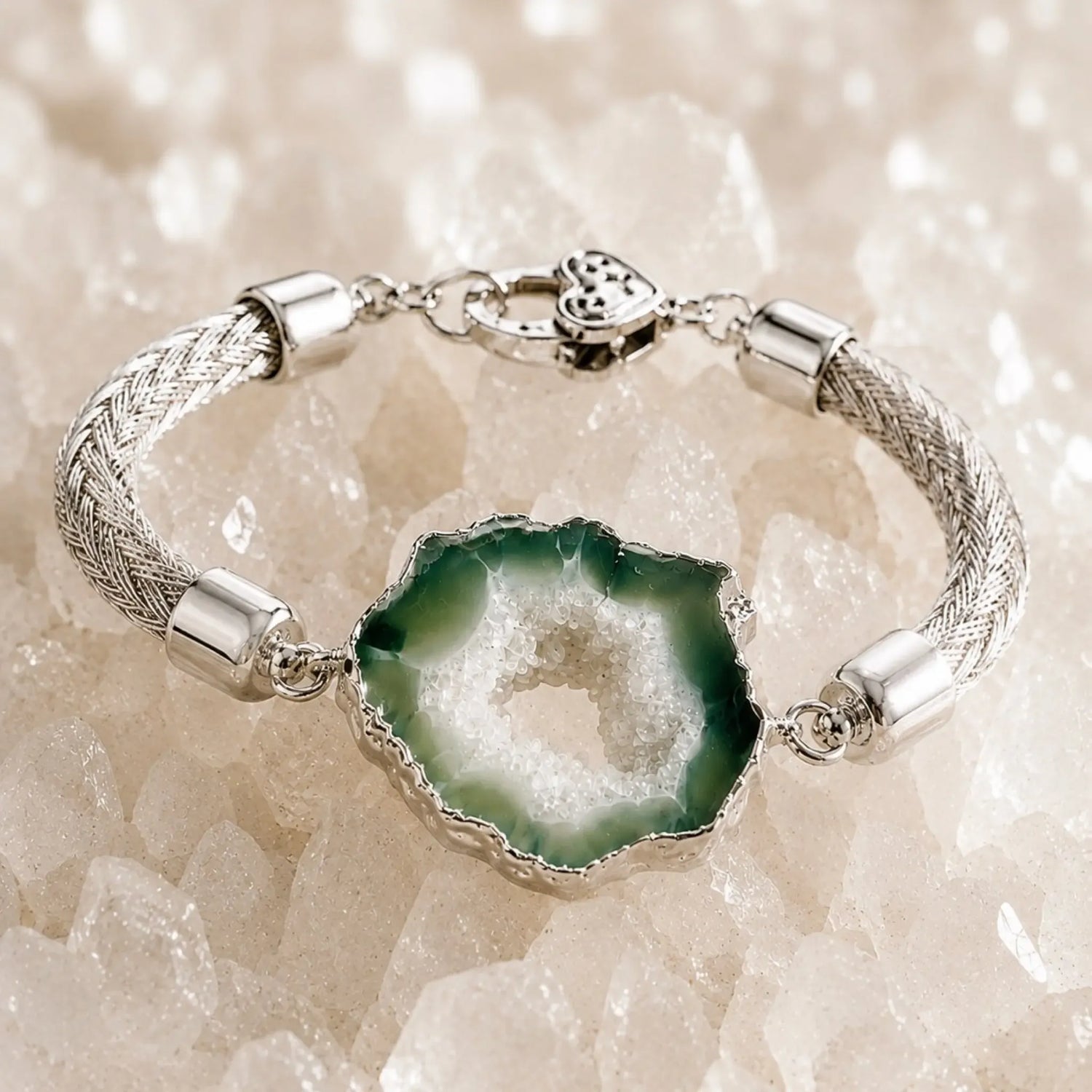 Ava handwoven .999 fine silver bracelet with a natural green agate druzy centre gently elevated above white quartz, highlighting the sculptural woven silver design, polished sterling silver end caps, and the natural crystalline texture of the druzy.
