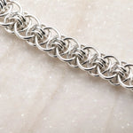 Close-up of the Avalon bracelet’s intricate Celtic helm chainmaille weave, showing individually handwoven sterling silver rings.