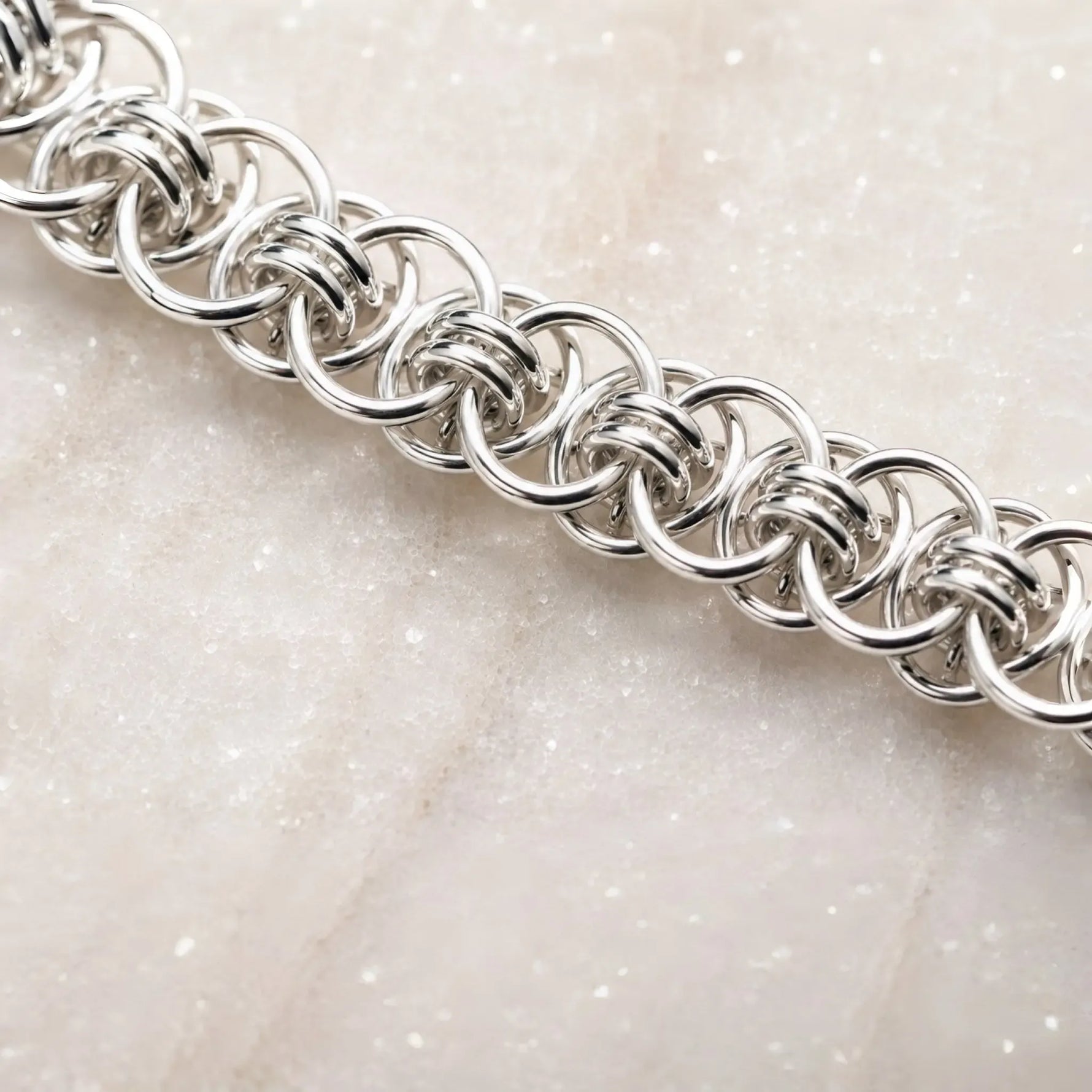 Close-up of the Avalon bracelet’s intricate Celtic helm chainmaille weave, showing individually handwoven sterling silver rings.