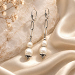 Callie freshwater pearl earrings with silver paperclip chain styled on ivory silk and white quartz
