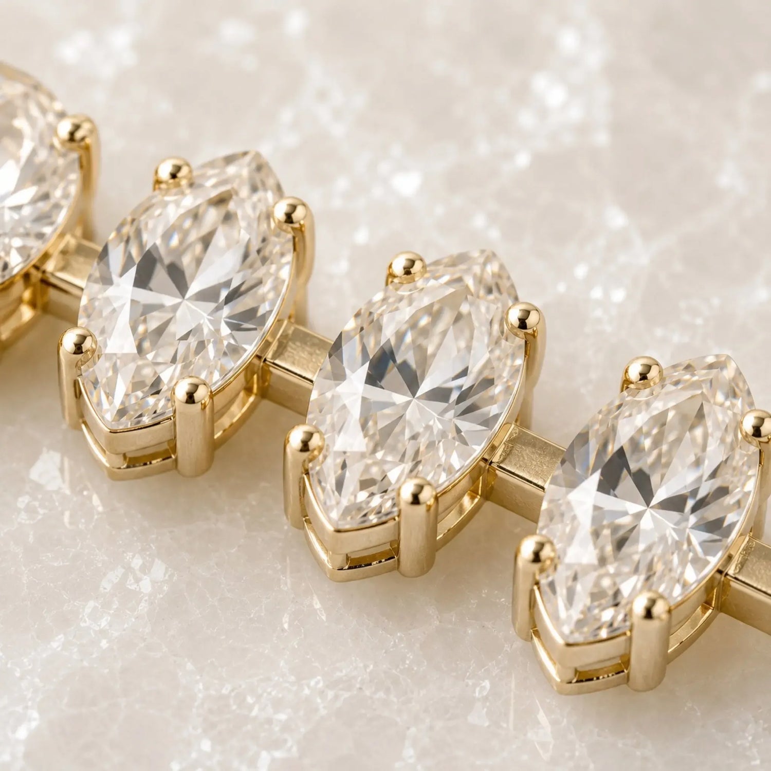 Macro detail of the Capri Gold Crystal Tennis Bracelet showing marquise-cut European crystal facets, champagne gold prongs, connector bars, and handcrafted setting.