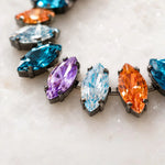Macro detail of the Capri Multi-Color Crystal Tennis Bracelet highlighting precision-cut marquise crystals, gunmetal settings and exceptional craftsmanship.