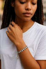 Capri tennis bracelet worn on model, styled for polished everyday elegance with timeless crystal sparkle.