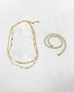 Cassia pearl necklace featuring adjustable gold extension chain and layered pearl design, versatile pearl necklace for women