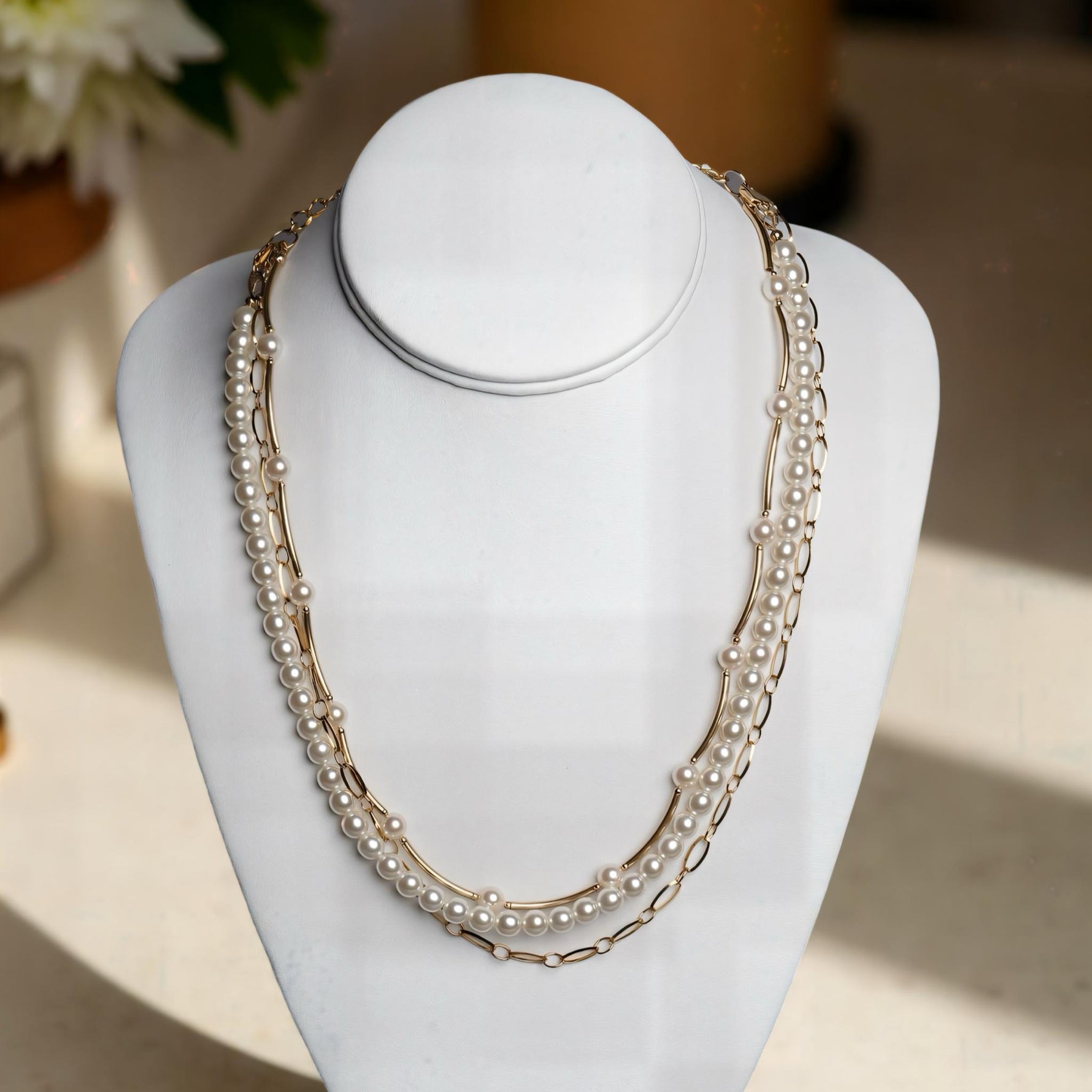 Cassia pearl necklace displayed on bust showing layered pearl and gold chain design, a classic yet modern pearl necklace for women