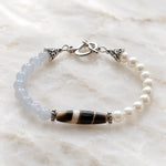 Elodie Blue Chalcedony & Snow Czech Crystal Pearl Bracelet with Tibetan agate focal stone on polished white quartz.