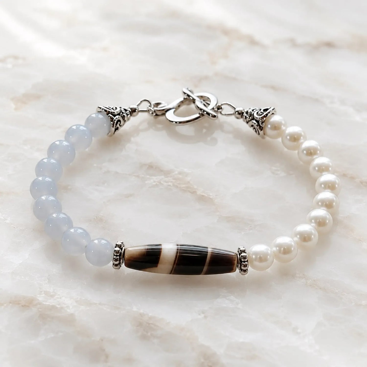 Elodie Blue Chalcedony & Snow Czech Crystal Pearl Bracelet with Tibetan agate focal stone on polished white quartz.