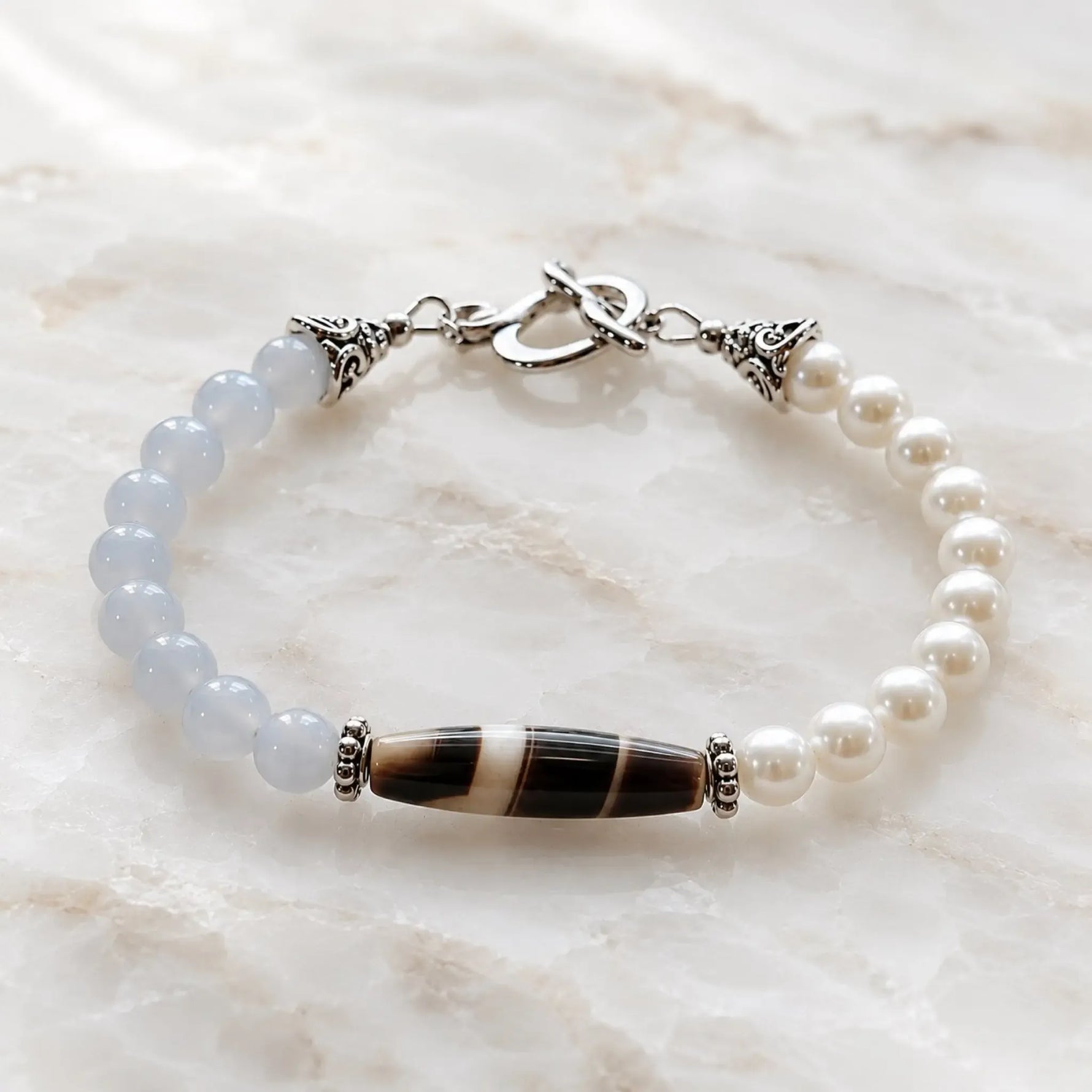 Elodie Blue Chalcedony & Snow Czech Crystal Pearl Bracelet with Tibetan agate focal stone on polished white quartz.