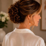 Rear detail view of handcrafted sterling silver threader pearl earrings with Swarovski® Crystal Pearls, showing the thread-through design and elegant movement on the Carabella model.