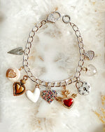 Micro-pavé heart lobster clasp detail on the Esme charm bracelet with refined sparkle and elegant finish.