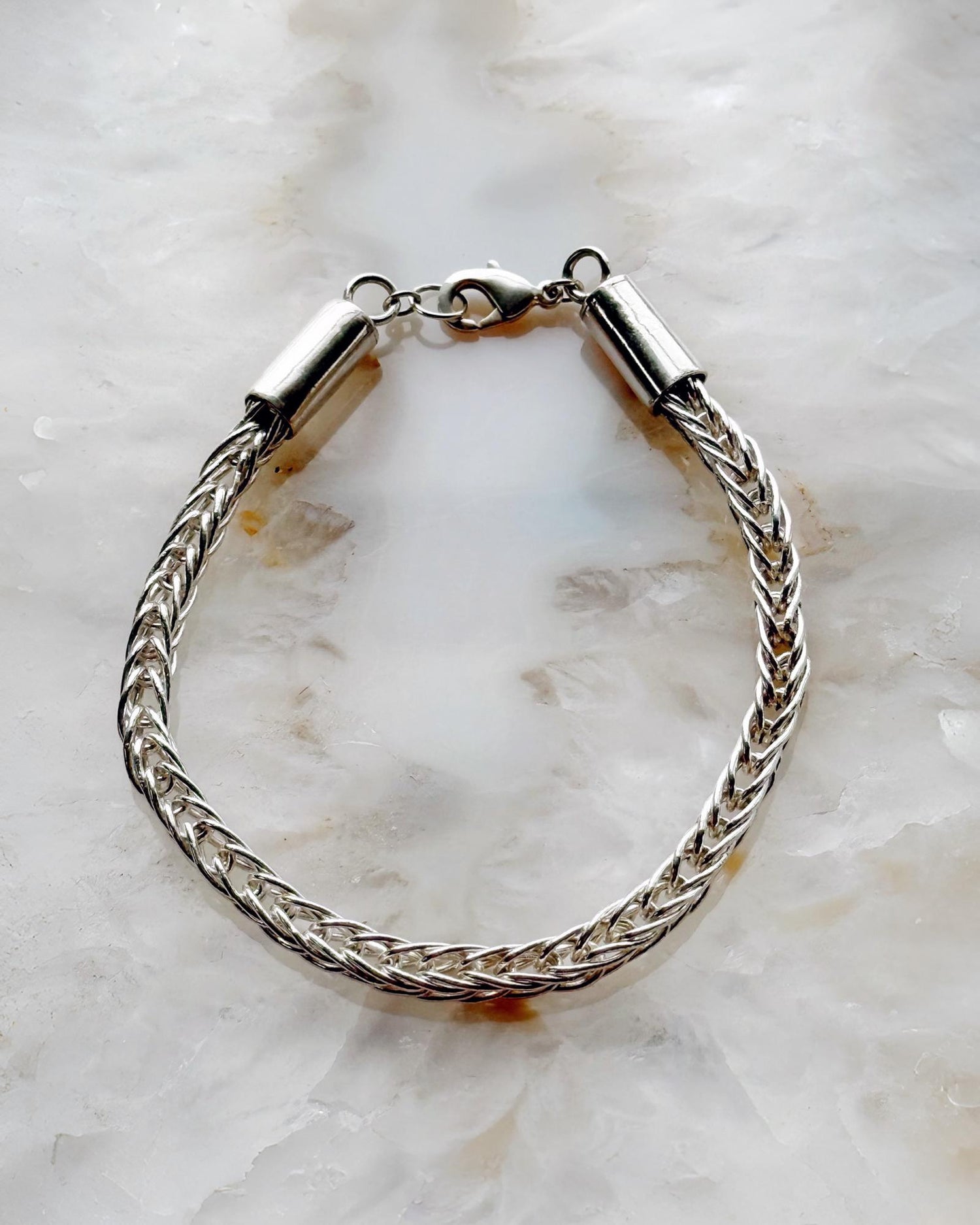 Close-up of the Evelyn Fine Silver Bracelet showing hand-woven .999 fine silver links with a sterling clasp—each link cut, fused, and woven by hand for exceptional craftsmanship.