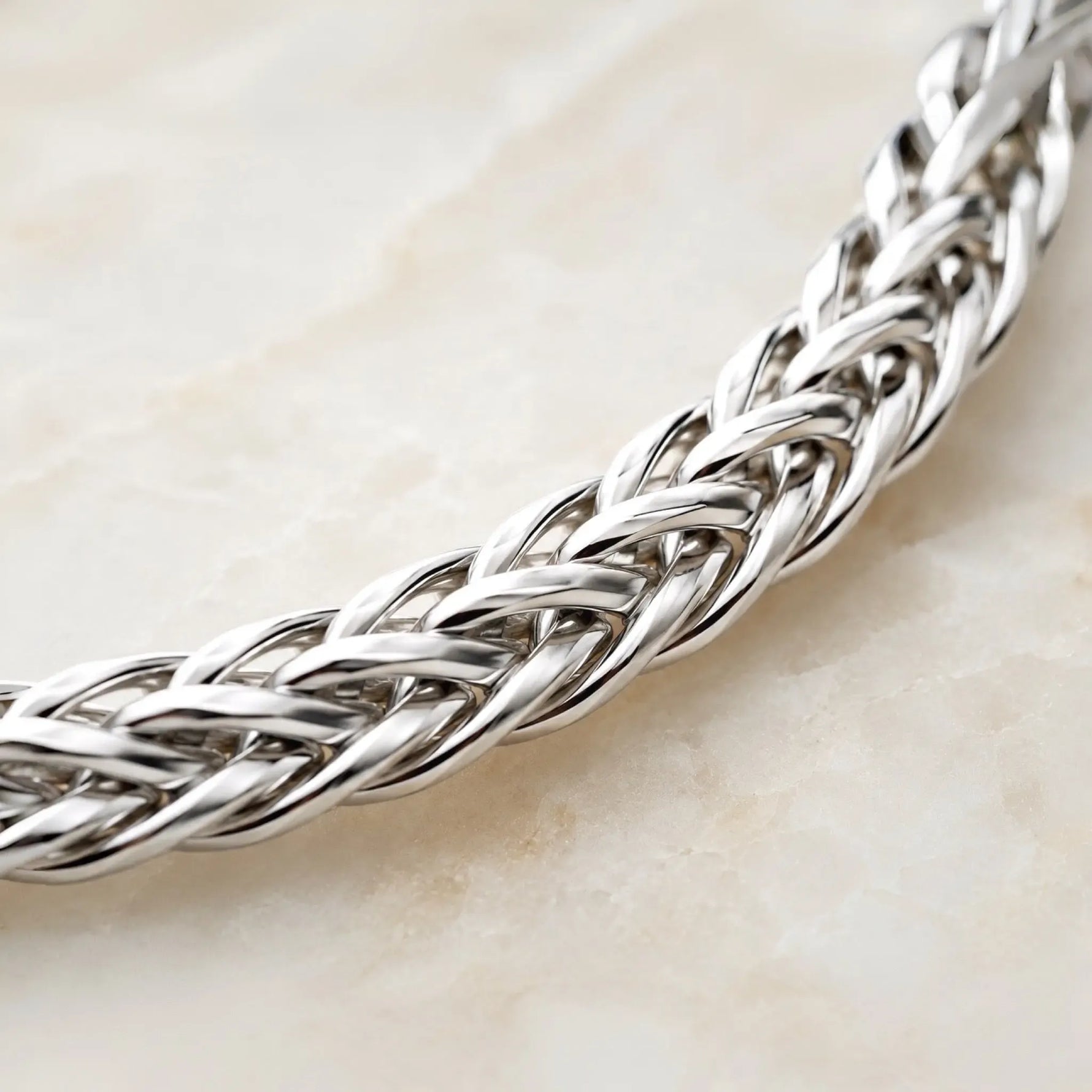 Close-up macro of the Evelyn fine silver bracelet highlighting the intricate handwoven silver links and exceptional craftsmanship.