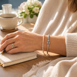 Gemma handwoven .999 fine silver bracelet layered naturally with the Leilani Swarovski® Crystal Pearl Bracelet, styled for elegant everyday wear.