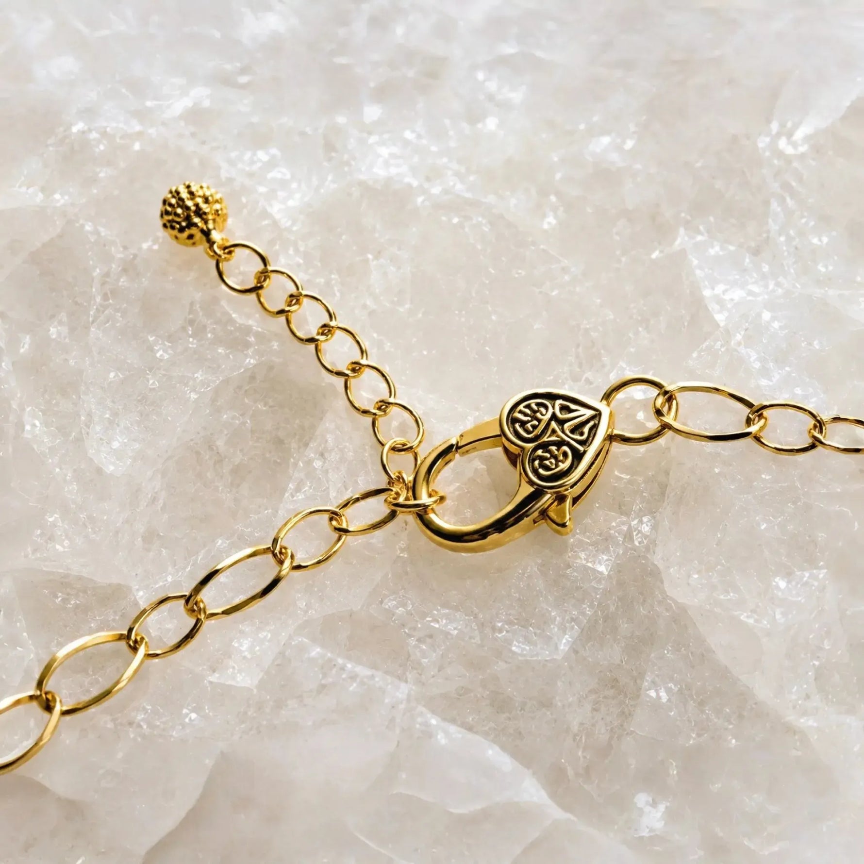 Imperial Blossom Swarovski® Crystal Pearl Necklace clasp detail featuring an adjustable gold-plated lobster clasp, extension chain, and decorative end bead on a white quartz crystal background.