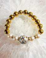 Imperial Blossom Stretch Bracelet by Carabella by Cheryl featuring a rare Japanese Tensha focal bead, Austrian Crystal cream rose pearls, gold-plated hematite beads, and crystal rondelles, handcrafted in Canada.