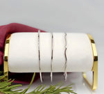 Sterling silver bangle bracelets with hand-textured finishes, minimalist artisan silver bangles by Carabella by Cheryl