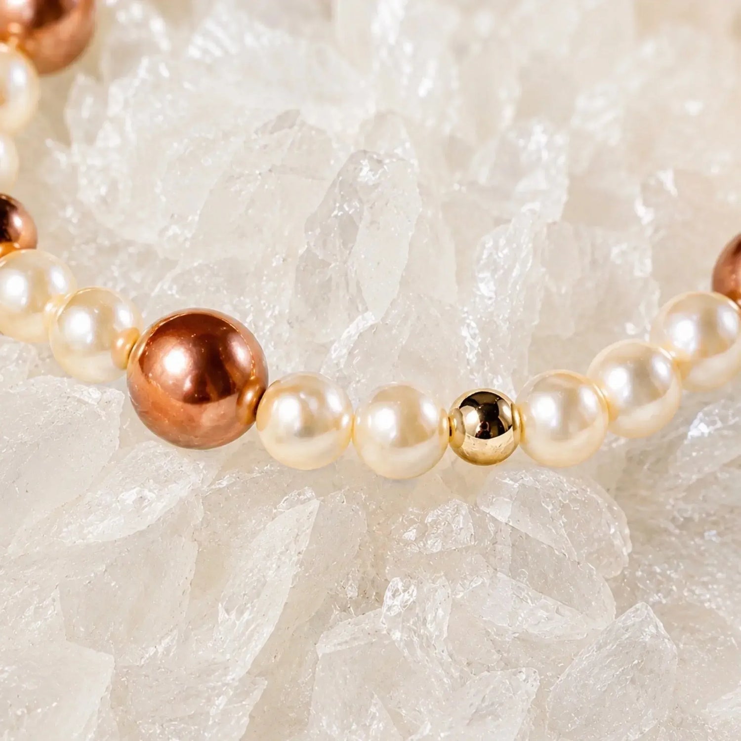 Close-up of the Meli Swarovski® Crystal Pearl Bracelet highlighting luminous cream Swarovski® Crystal Pearls, rose gold Swarovski® Crystal Pearls, and 14k gold-filled accent beads.