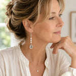 Woman wearing Mia Freshwater Pearl Earrings in a refined professional setting, styled with an ivory blouse and natural light for an elegant everyday look.