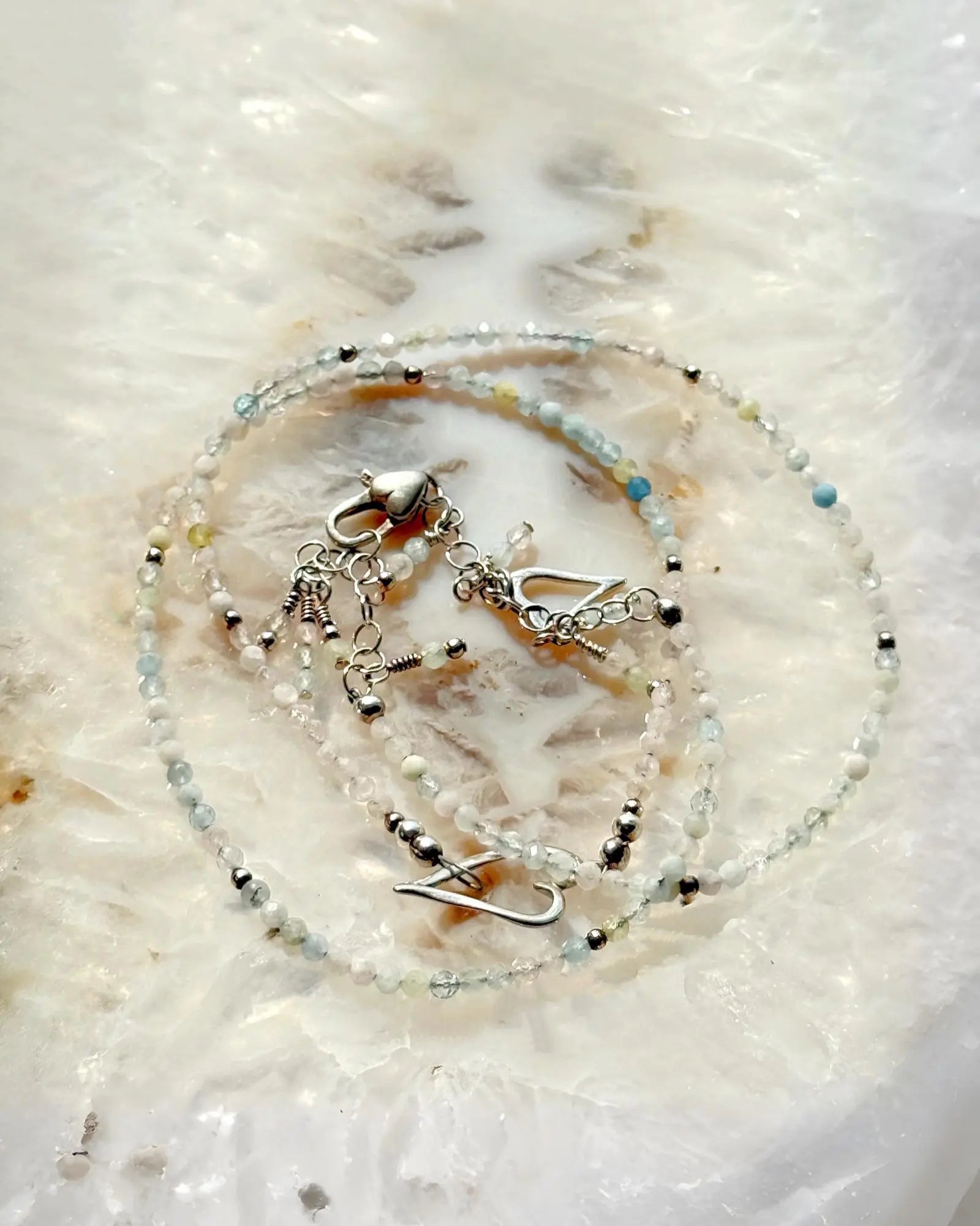 Close-up of morganite gemstone wrap bracelet showcasing sterling silver details and delicate craftsmanship