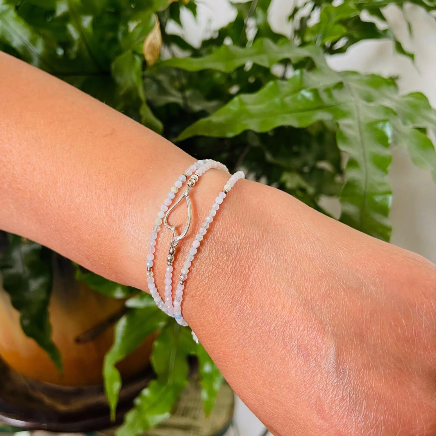 Morganite gemstone wrap bracelet styled as a triple wrap bracelet with soft romantic elegance