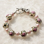 Dimensional view of the Peony bracelet featuring handcrafted Murano glass floral beads, Swarovski® Crystal Pearls and sterling silver accents.