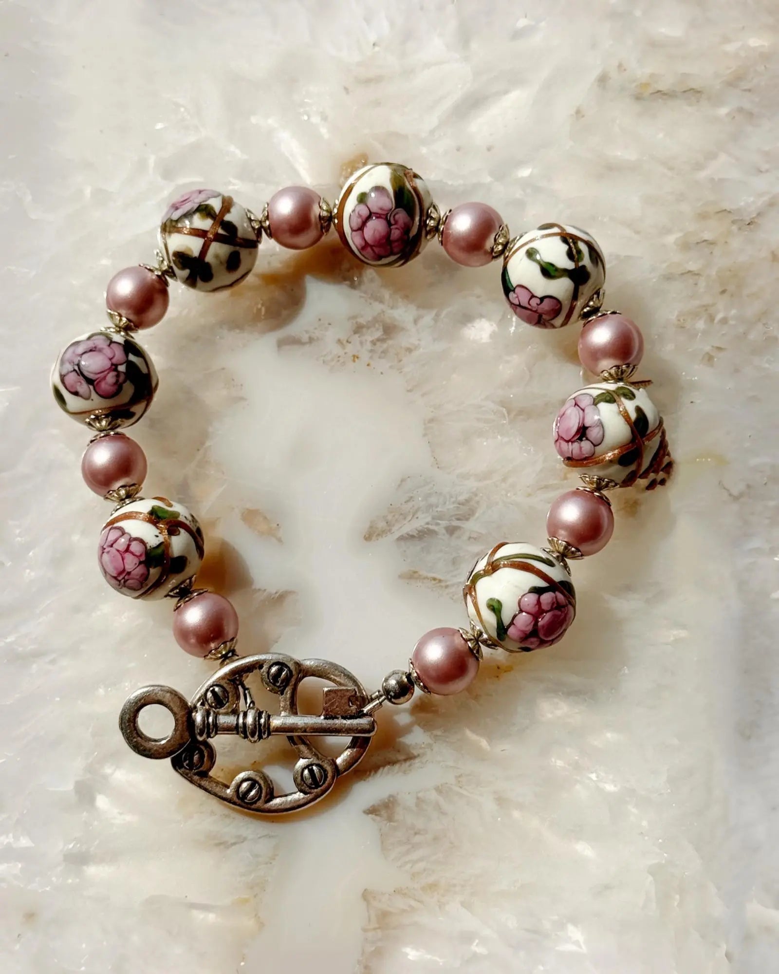 Peony Murano Glass Bracelet showcasing painted floral Murano glass beads and refined European crystal pearls in an elegant circular composition