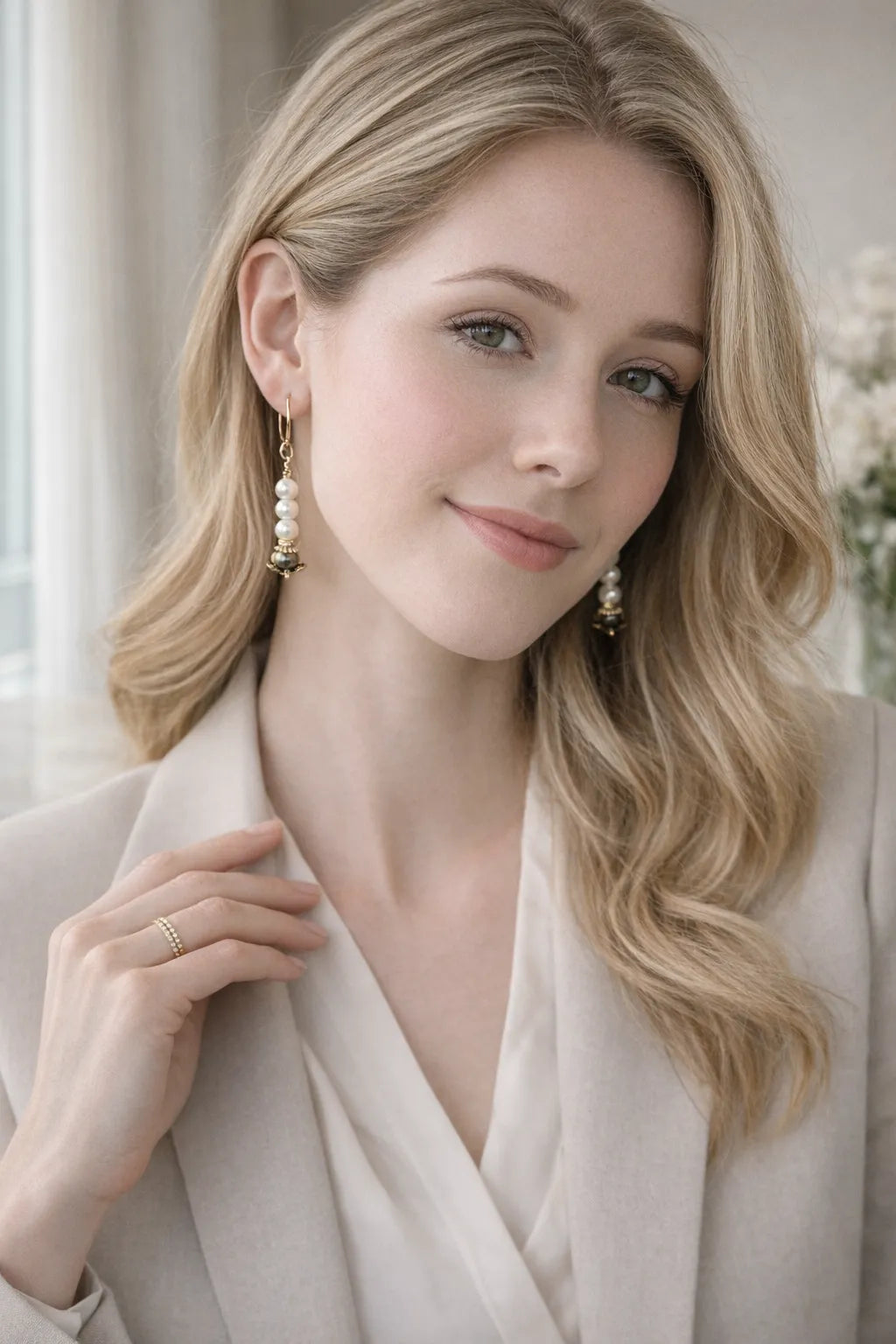 Serenity pearl drop earrings worn with a tailored blouse in a polished professional daytime setting