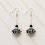 Venezia handcrafted Murano glass drop earrings with sterling silver on Carabella white quartz background.
