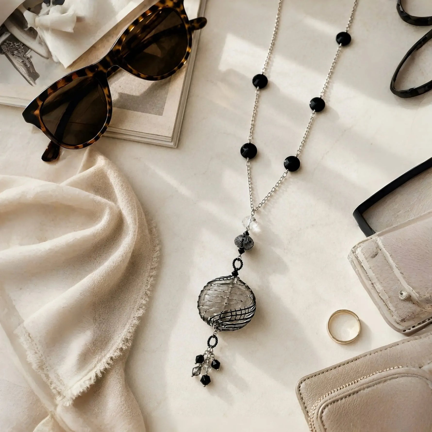Venezia Murano glass necklace styled in an elegant lifestyle flat lay with refined accessories on a premium marble surface.