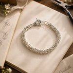 Zoe sterling silver Byzantine weave bracelet displayed within the Carabella atelier, celebrating handcrafted Canadian craftsmanship and thoughtful design.
