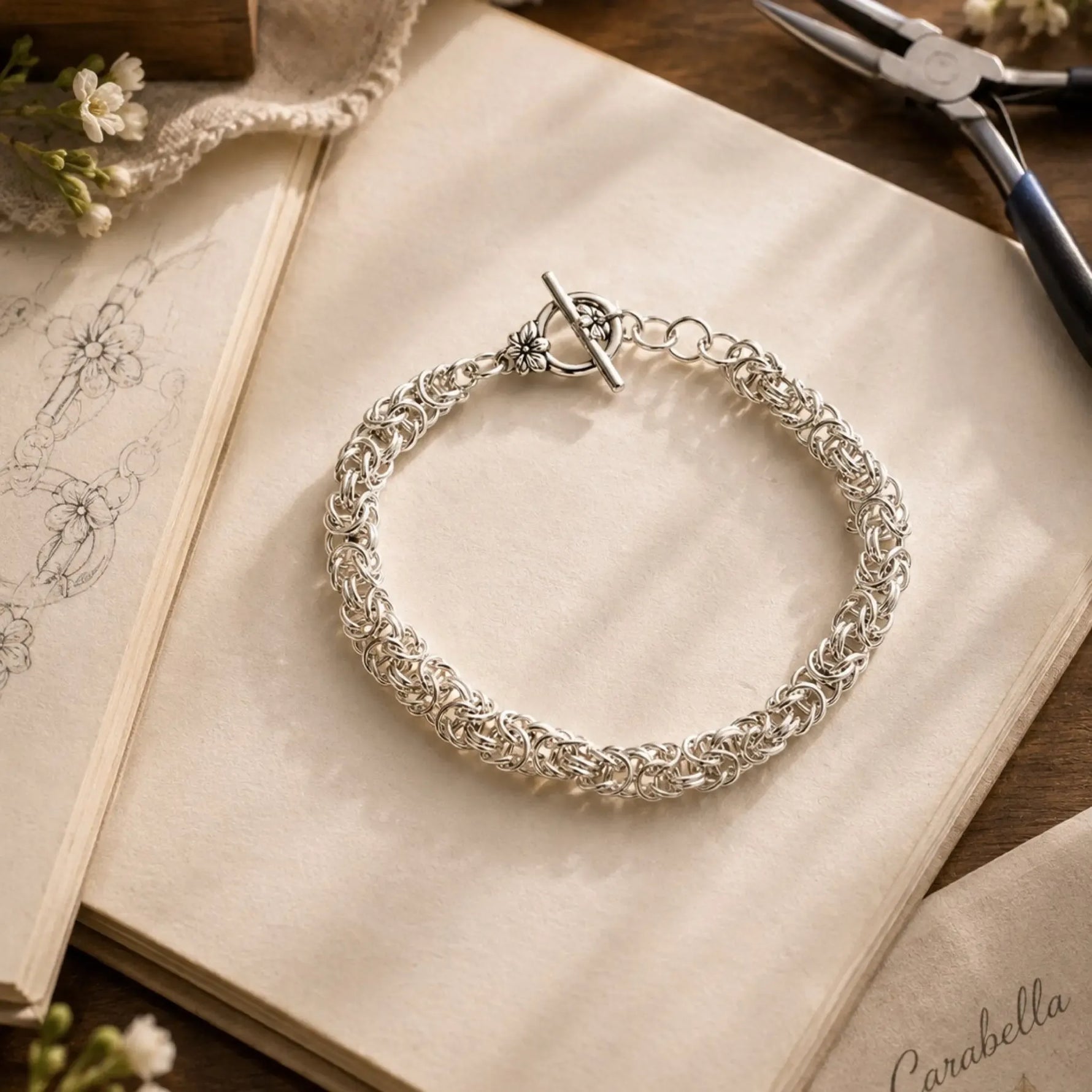 Zoe sterling silver Byzantine weave bracelet displayed within the Carabella atelier, celebrating handcrafted Canadian craftsmanship and thoughtful design.