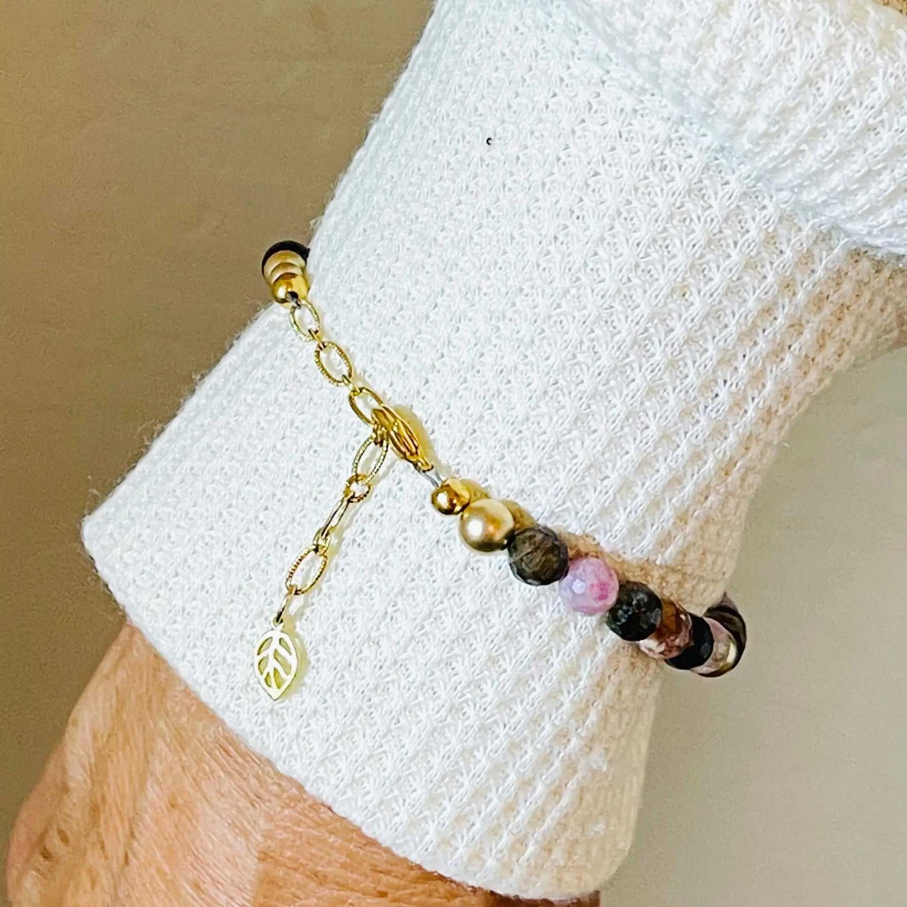 Detail view of the Layla Gemstone Bracelet clasp and extension chain, featuring coordinating gold elements and a leaf charm for an elegant adjustable fit.